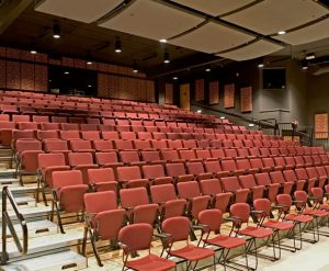 Photo of the New Stage auditorium showing the wheelchair-accessible first row and the other roughly two hundred fifty seats.