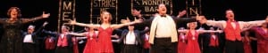Photo of a red and black-dressed chorus from the show "42nd Street"