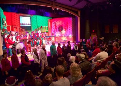 The Broadway Rose Theatre Guild leads the crowd in the final song.