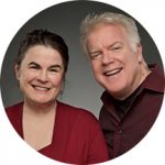 A small, round photo of the Broadway Rose Theatre Company's founders, Sharon Maroney and Dan Murphy.