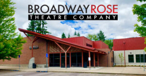 Photo of the Broadway Rose Theatre facade with a graphic of the company logo above it in the sky.