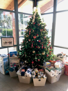 The Christmas Tree in the lobby of Broadway Rose, for donating goods to the Good Neighbor Center.