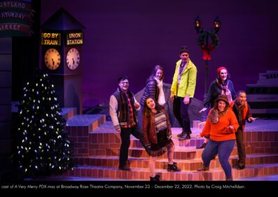 The cast of "A Very Merry PDX-mas" at Broadway Rose Theatre Company, November 23 - December 22, 2022. Photo by Craig Mitchelldyer.