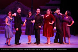 The cast of A Very Merry PDX-mas at Broadway Rose Theatre Company, November 23 - December 22, 2022. Photo by Craig Mitchelldyer.