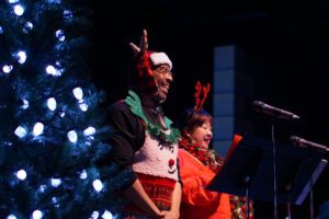 Broadway Rose guild members take the stage for a song.