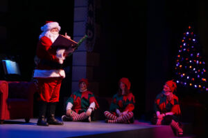 Santa reading The Nutcracker Prince to the audience.