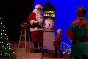 Santa meeting the kids after the show, getting Christmas lists and taking photos with families.