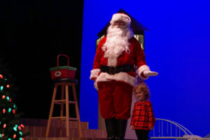 Santa meeting the kids after the show, getting Christmas lists and taking photos with families.