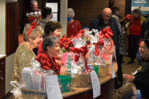 The Broadway Rose Guild members in the lobby selling raffle tickets.