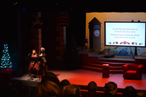 Broadway Rose staff singing the first song of the day.