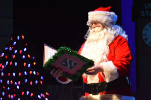Santa reading The Nutcracker Prince to the audience.
