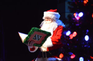 Santa reading The Nutcracker Prince to the audience.
