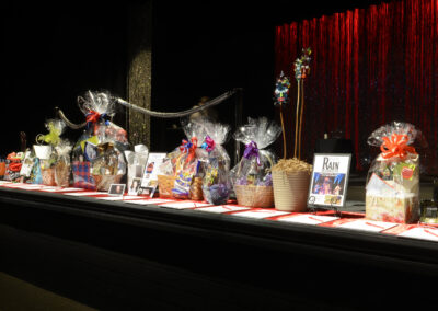 What to find at the gala: Auction baskets full of things to bid on lined up across the front of the stage.