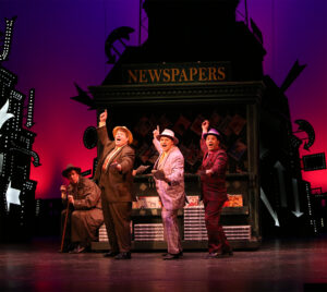 Guys and Dolls news stand