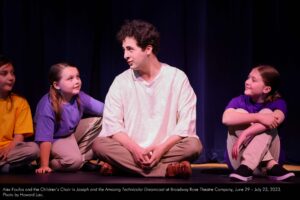 Alex Foufos and the Children's Choir in Joseph and the Amazing Technicolor Dreamcoat at Broadway Rose Theatre Company, June 29 - July 23, 2023. Photo by Howard Lao.