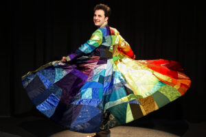 Alex Foufos as Joseph, spinning his long colorful coat.