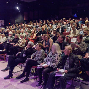 Photo of a Broadway Rose audience laughing and smiling.