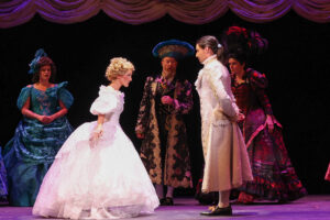 Production photo - Cinderella and Prince Topher bow to one another.