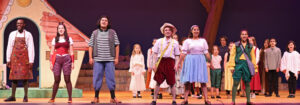Photo from the final song of Pinocchio. The cast and kids are spread across the stage as they sing the final number out to the audience.