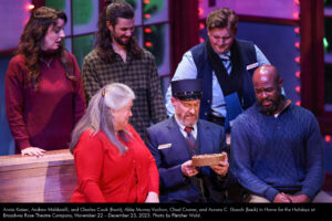 Annie Kaiser, Andrew Maldarelli, and Charles Cook (front); Abby Murray Vachon, Chad Craner, and Aurora C. Gooch (back) in Home for the Holidays at Broadway Rose Theatre Company, November 22 – December 23, 2023. Photo by Fletcher Wold.