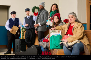Aurora C. Gooch, Andrew Maldarelli, Charles Cook, Chad Craner, Abby Murray Vachon, and Annie Kaiser in "Home for the Holidays" at Broadway Rose Theatre Company, November 22 - December 23, 2023. Photo by Fletcher Wold.