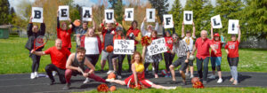 Photo of the Broadway Rose staff dressed in various sports uniforms and holding a hodgepodge of equipment, balls, and sports paraphernalia. We clearly aren't sports people.