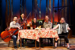 Photo of the Spitfire Grill band sitting on the restaurant set.