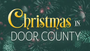 Logo for Christmas in Door County. The words hang in front of a close up photo of a Christmas tree.