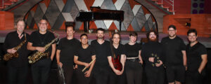 Photo of the Beautiful band in front of the stage.