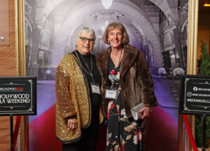 Photo of Patsy Britton on the left and Sharon Hinds on the right at the entrance of our 2024 Hollywood Gala Weekend fundraiser.