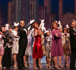Photo of the performers bowing at the end of our 2015 production of Thoroughly Modern Millie.