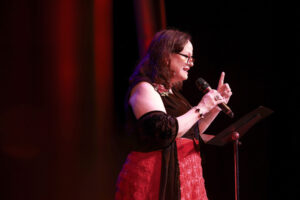Photo of Sharon Maroney speaking to the audience at the 2025 Gala.