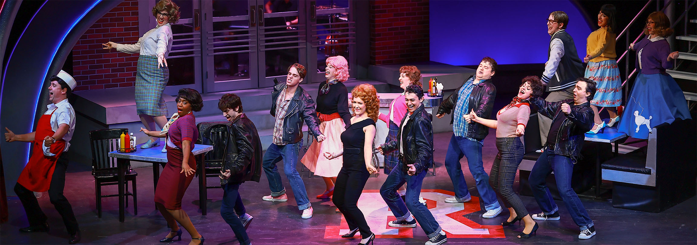 Grease - 2025 Photo from our production of Grease. The cast is all dancing together in unison for the final song of the show called You're the One That I Want.