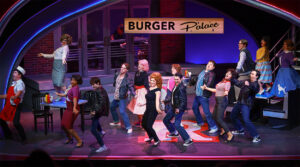 Photo from our production of Grease. The cast is all dancing together in unison for the final song of the show called You're the One That I Want.