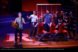 Christian Lane Miller with the cast of Grease at Broadway Rose Theatre Company, April 10 – May 18, 2025. Photo by Fletcher Wold.