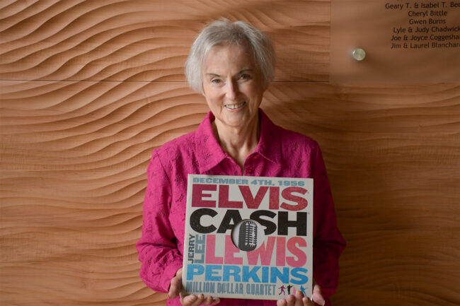 A photo of Heidi Heydlauff holding a vinyl edition of the Million Dollar Quartet original cast album.