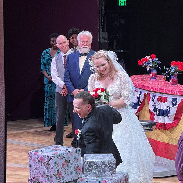 Photo from the stage left wing looking on stage during a performance of Waitress, offering a unique perspective of a production from backstage.