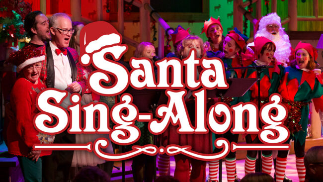 Logo for Santa Sing-Along over a photo from one of the events. The cast is up on stage in holiday gear singing.