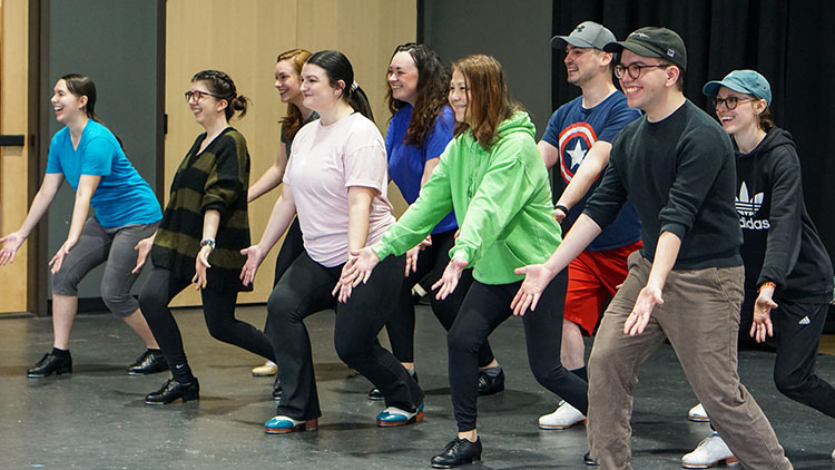 Stage the Song Photo of a group in one of our dance classes all striking a pose.