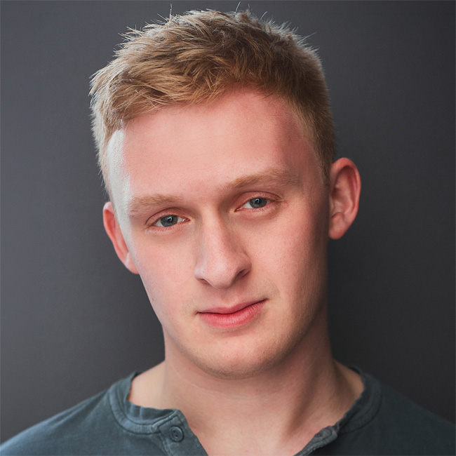 A headshot photo of Ryan Burton.