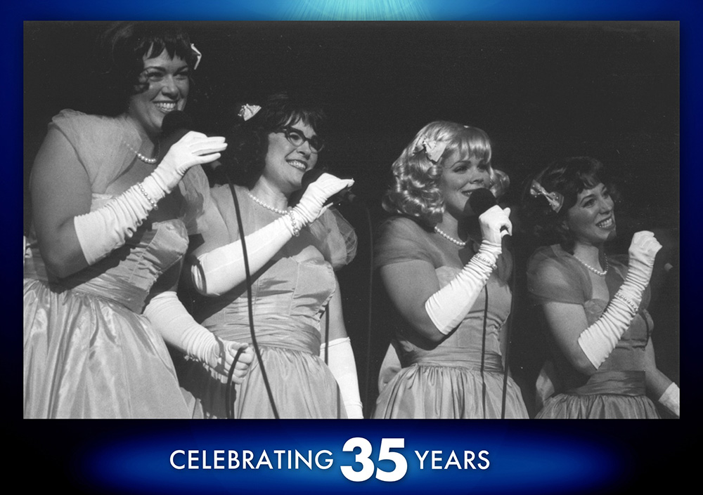 Spotlight 2 - Selling Out Shows A photo from A Tafetta Christmas, a 2001 production. Here we find the four leading ladies standing in a row with matching dresses singing into handheld microphones like a classic all ladies jazz ensemble.