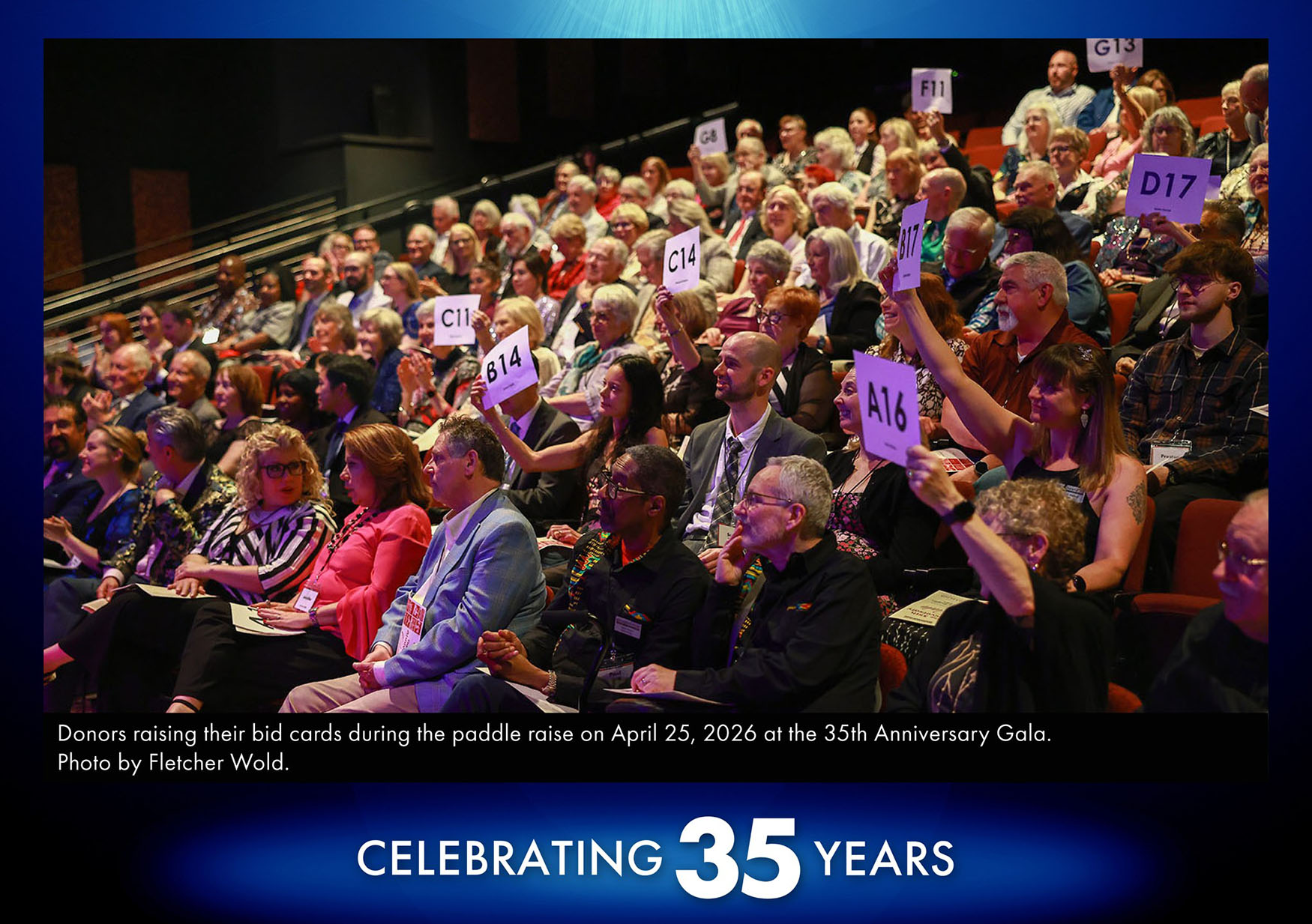 Gala Fundraiser audience A photo from one of our fundraiser galas showing the audience raising their bid cards to donate in an incredible show of support for not just Broadway Rose, but locally produced art.