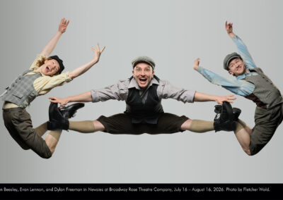 Evan Beesley, Evan Lennon, and Dylan Freeman in Newsies at Broadway Rose Theatre Company, July 16 - August 16, 2026. Photo by Fletcher Wold.